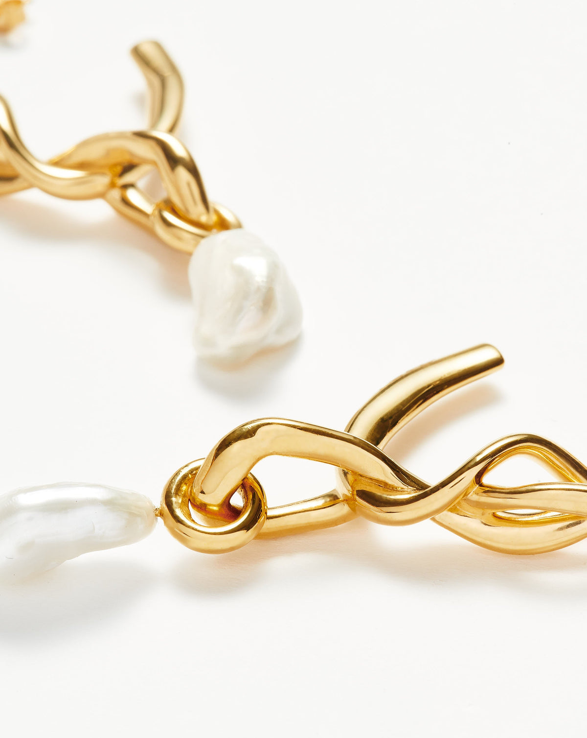 Missoma Molten Baroque Pearl Knot Drop Hoop Earrings in gold-tone plated metal, view 2
