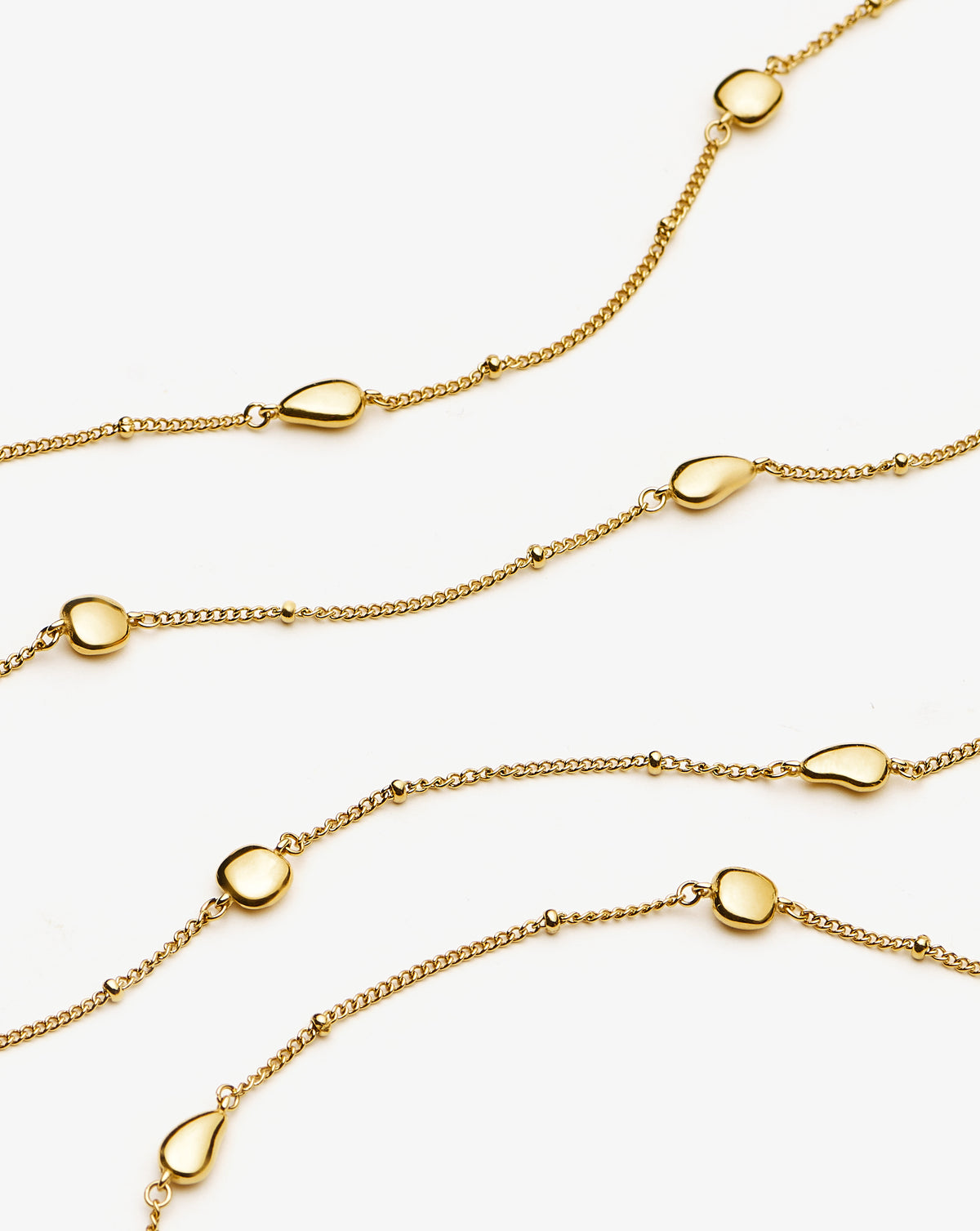 Missoma Molten Teardrop Multi Charm Wraparound Necklace in gold-plated metal, third view