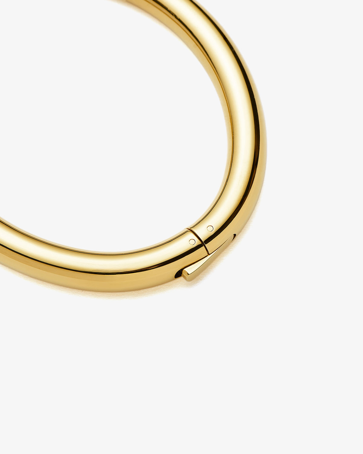 Missoma Chunky Round Hinged Bangle in gold-plated metal, third view