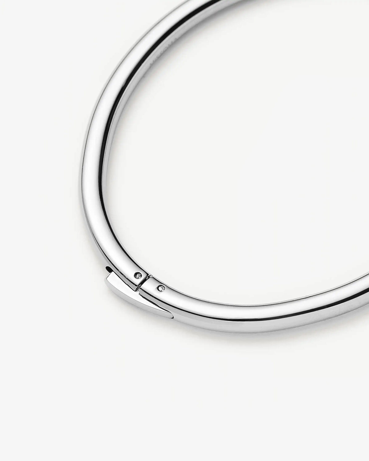 Missoma Classic Round Hinged Bangle in silver/rhodium-plated metal, third view